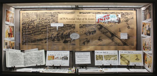 Oak Bend library display case "A Walk in 1875 St Louis" by Sappington-Concord Historical Society members.