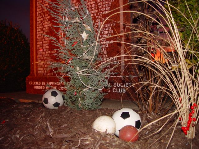 Imaginary mockup of Christmas decorations that a World War I dough boy might have had at hand in the field. Photo shot in Sappington-Concord Memorial Park at Gravois and Sappington Roads. Scene set in front of World War II Honor Roll at sunset.