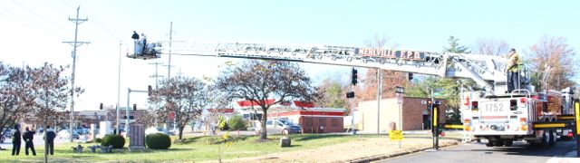 Mehlville fire department restores flag to pole in Memorial Park, Sunday, November 22, 2015.