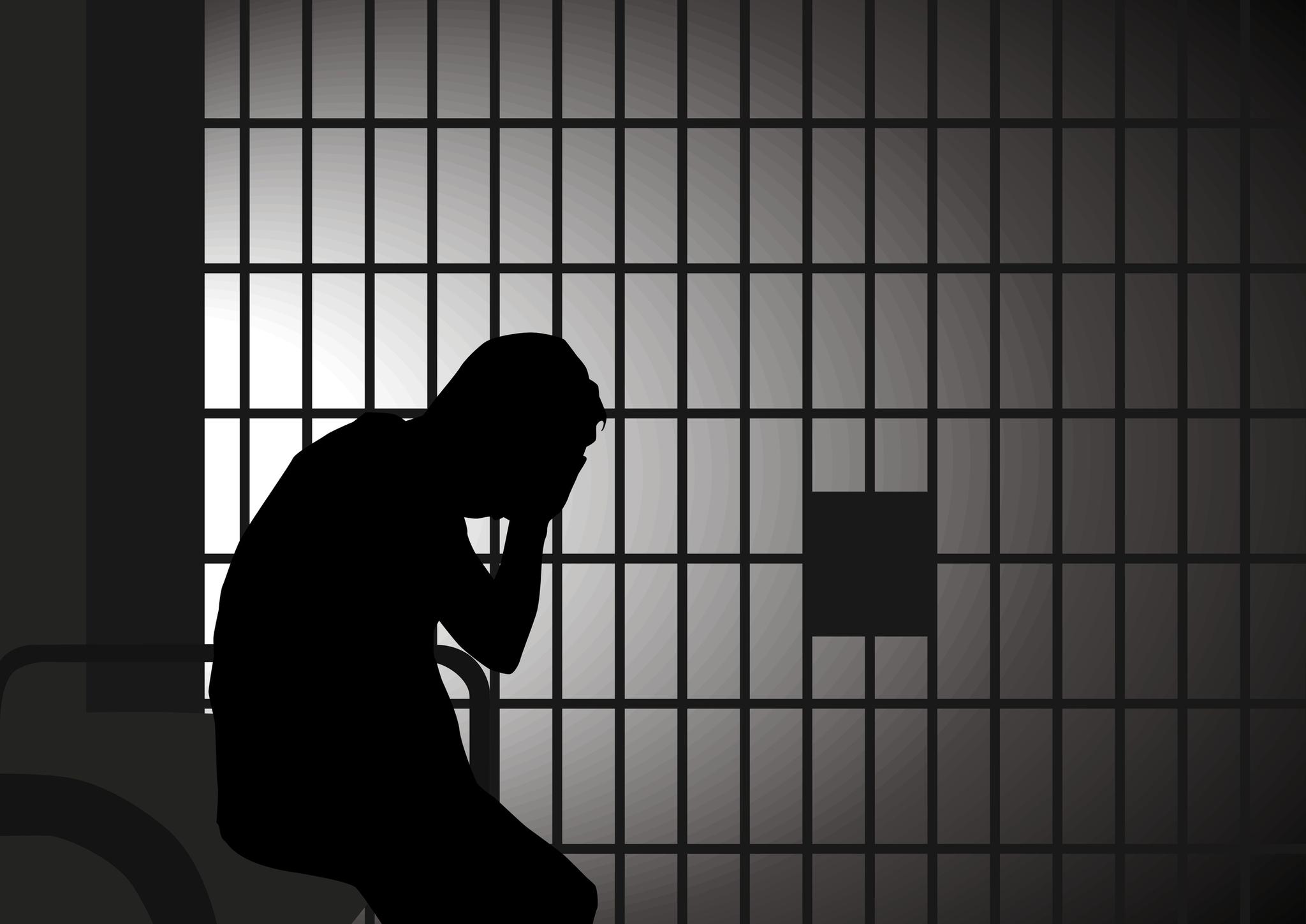 Person silhouetted behind bars. From: http://www.ssc.wisc.edu/clsj/media/jail/