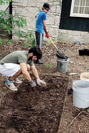 Lindbergh High School students Osama Ibraheem (front) and Evan Moss search for historic treasures at the Sappington House. photo by Diana Linsley.