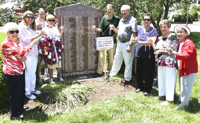 SCHS board members toast the World War II Honor Roll on the 20th anniversary of the rebuilding of the 1944 monument.