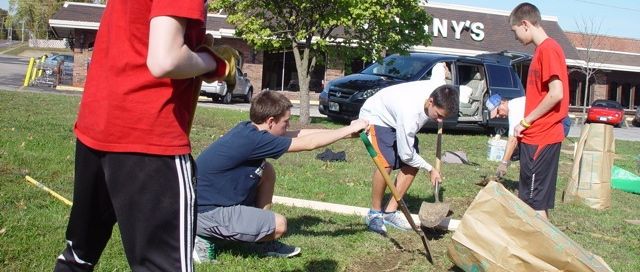 Boy Scout Troop 646 Fritz Eagle in white leading his Eagle Scout project in Memorial Park