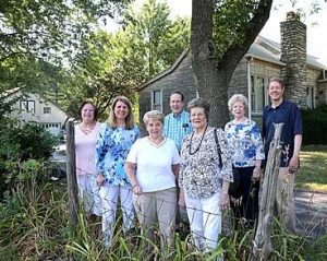 SCHS board members on Wagner farm with house behind. Pictured, from left: Terry Rupp, Kathleen Wiesehan, Sue Steinnerd, Ray Steinnerd, Jean Heutel, Donna Wagner and Stephen Hanpeter. photo by Ursula Ruhl of the South County Times.