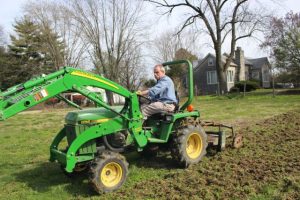 Bert Markway plowing the north field.