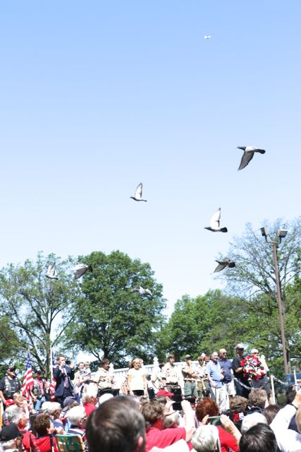 Doves of peace circle over crowd at annual SCHS Memorial Day ceremony. Photo by Bill Brinkhorst